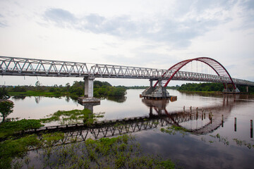 Fototapeta na wymiar Kahayan Bridge, icon and landmark of Palangka Raya city, the biggest bridge over Kahayan River.