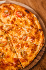 Hot pizza on a tray. Delicious margherita pizza close-up. Appetizing Italian food concept