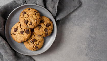 top view shot of Chocolate chip cookies on grey plate, copy space