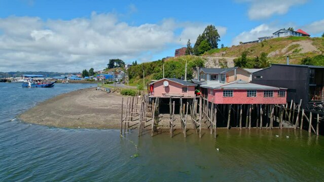 Drone Flyover Colorful Traditional Stilt Houses In Castro, Chiloe 4K