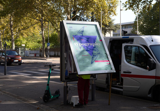 Mockup of man replacing customizable sign in city
