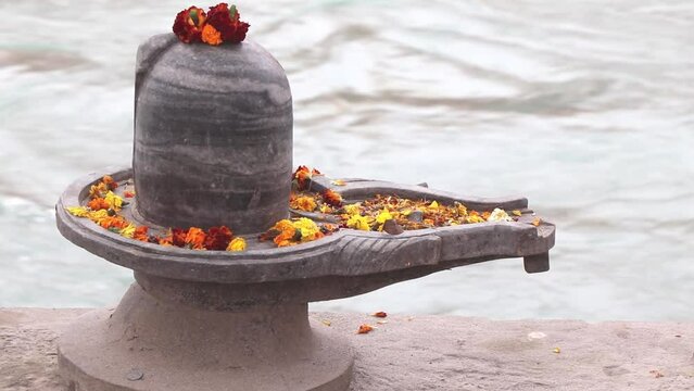 Shiva lingam on the bank of river ganga.In Hinduism, shiva lingam is a highly sacred stone to devotees.