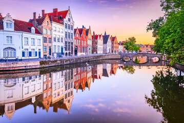 Naklejka premium Bruges, Belgium. Sunrise over Spiegelrei Canal, Flanders cityscape