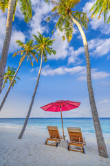 Beautiful coast sea sand sky. Tropical relax beach sunny summer island landscape. Love couple chairs umbrella palm leaves romantic coast. Luxury tourism destination. Honeymoon vacation best holiday