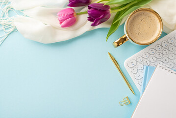 Greet the springtime vibe with a flat lay of creamy latte, vibrant tulips, a sleek keyboard, sketchpad, pen, paper clip, and a cozy wrap on a soft blue surface, leaving space for your message