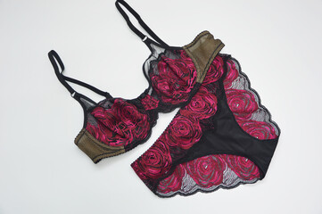 Lingerie. Pink with black lace bra and panties on a white background. Sexy women's underwear.
