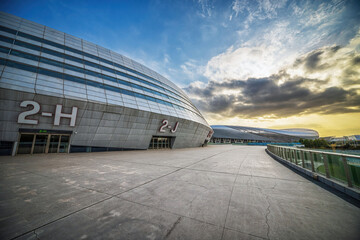 Evening Sky Over Modern Convention Center's Curved Structure