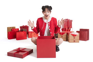 Happy young woman with many gifts