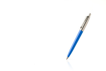Blue plastic and metal ballpoint pen on white isolated background
