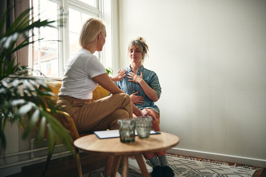 Touch therapy between a therapist and a client in a calm setting