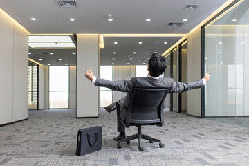 Cheerful businessman punching the air