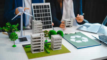 Sustainable business meetings at desks, green energy concepts. People in business suits discussing...