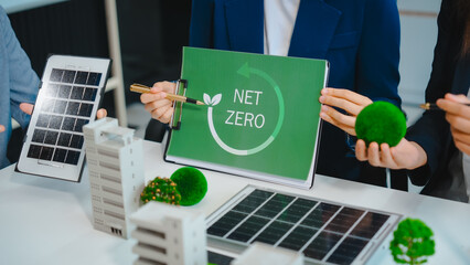 Sustainable business meetings at desks, green energy concepts. People in business suits discussing...