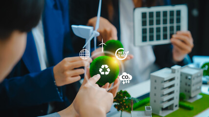 Sustainable business meetings at desks, green energy concepts. People in business suits discussing...