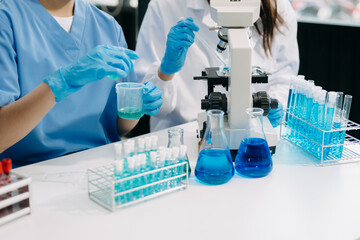 Modern Medical Research Laboratory Portrait of Team Scientists Working, Using Digital Tablet, Analyzing Samples, Talking. for Medicine, Biotechnology Development