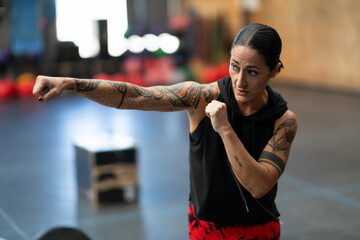 Woman shadowboxing in a cross training gym