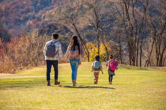 Happy young family hiking outdoors