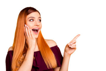 Portrait of shocked laughing young woman with open mouth and palm near cheek showing by her fingers on yellow background with copy space for text