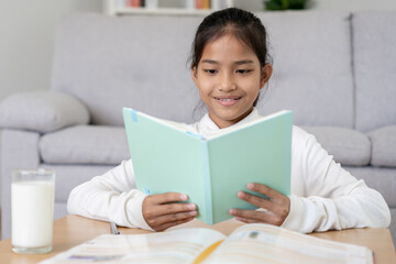 Naklejka premium girl learn at home. Do homework, encourage for exam. Asia girl happy Homeschool, education, Practice, tech book, study, child, course for Asian children
