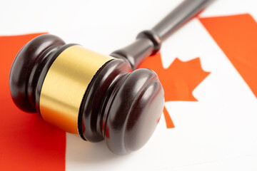 Canada flag with judge hammer, Law and justice court concept.