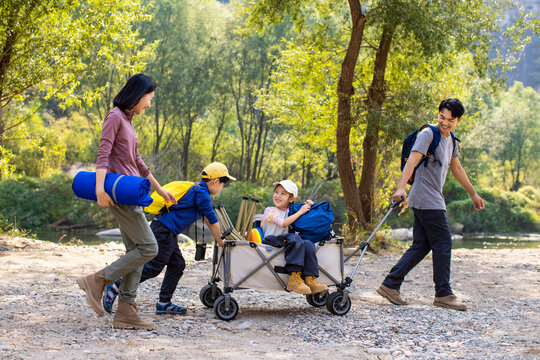 Happy young family having fun outdoors