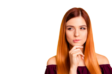 Portrait of red straight-haired attractive cute nice curious young girl, hand touching chin, thoughtful. Copy space. Isolated over bright vivid yellow background