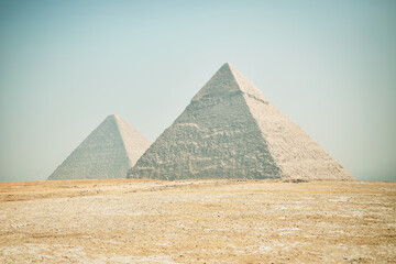 Fototapeta na wymiar Pyramids of Giza. Most visited Egyptian landmark. Ancient Egypt. Giza Necropolis. Vacation destination. Historic site. Tours and sightseeing