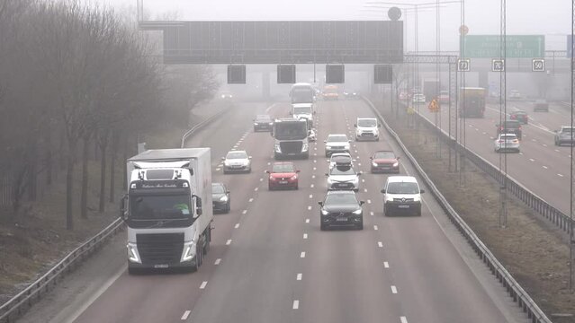 Stockholm, Sweden Southbound traffic on the E4 highway on a foggy day.  