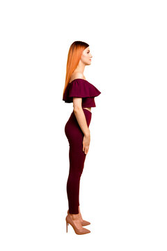 Full length body size photo portrait of elegant attractive graceful serious stunning nice pretty lady looking aside wearing maroon clothing isolated bright background