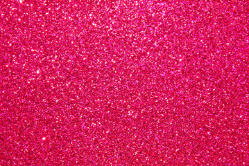 Pink defocused glitter texture as background

