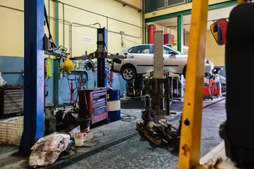 Car and mechanical equipment at workshop