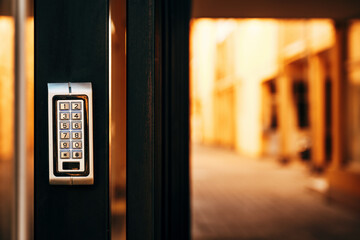 Keypad door lock at residential building entrance - obrazy, fototapety, plakaty