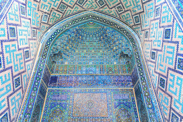 Muqarnas or honeycomb vaulting in iwan entrance to the Ulugh Beg Madrasah at Registan square....