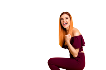 I said yes! Young happy girl celebrate the victory by hold her hand in fists looking at camera with big toothy smile isolated on yellow background with copy space for text