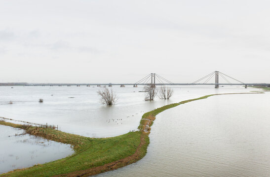 Netherlands, Aerial view of river Waal flooding surrounding land after prolonged rainfall