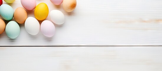 Vibrant Easter Egg Hunt: Colorful Decorations on White Wooden Surface