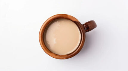 Obraz na płótnie Canvas Top-down view of simply poured pulque in a brown cup isolated on a white background with copy space. Traditional Mexican alcoholic beverage concept