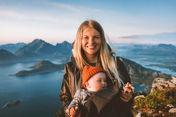 Mother traveling with baby healthy lifestyle outdoor family travel in Norway summer vacations happy...