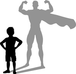 A superhero child or kid boy revealed by his shadow silhouette as a super hero in a cape.