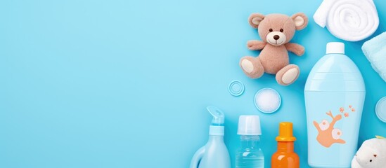 Variety of Baby Care Products Arranged on Vibrant Blue Background for Newborn Essentials Concept