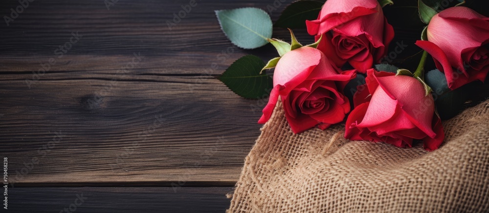 Poster elegant red roses arranged on a rustic wooden table for a romantic valentine's day setting