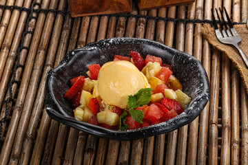 Sweet fruit salad with ice cream