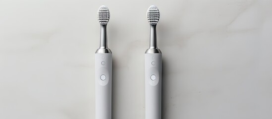 Modern Sonic Toothbrushes Duo on Clean White Surface - Dental Hygiene Concept