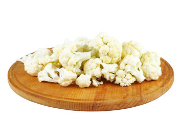 Cauliflower pieces on wooden cutting board isolated on white background