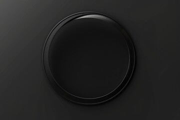 Simple black round button on a black wall. Suitable for technology or minimalistic design concepts