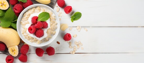 Nutritious Breakfast Delight: Wholesome Oats with Fresh Raspberries, Yogurt, and Banana on White...