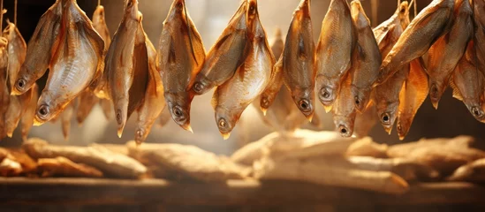 Fotobehang Variety of Freshly Harvested Dried Fish Hanging on Display in Coastal Market © HN Works