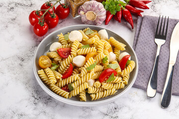 Italian pasta with mozzarella and tomato