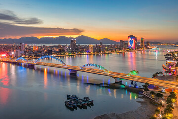 Dragon bridge at sunset which is considered as the icon of Da Nang city, Vietnam. Near Golden bridge on Ba Na hills. Da Nang is the most livable tourist city in Vietnam
