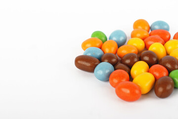 Peanut candy covered with colorful chocolate isolated on white background